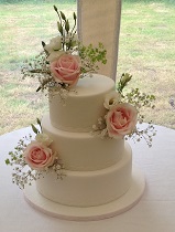 3 tier wedding cake with pink roses
